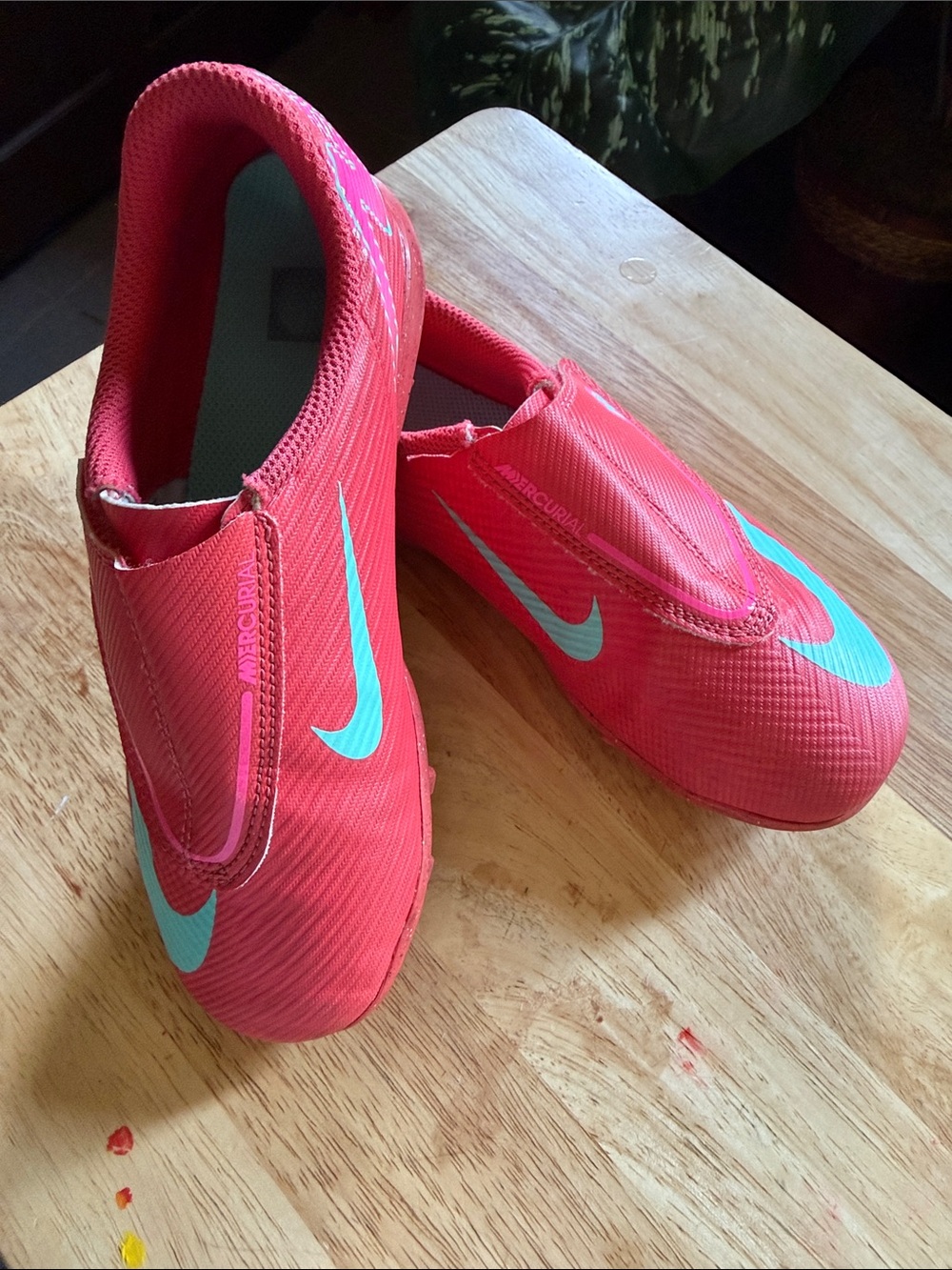 Nike Kids pink Slip-On indoor soccer cleats with Teal Swoosh